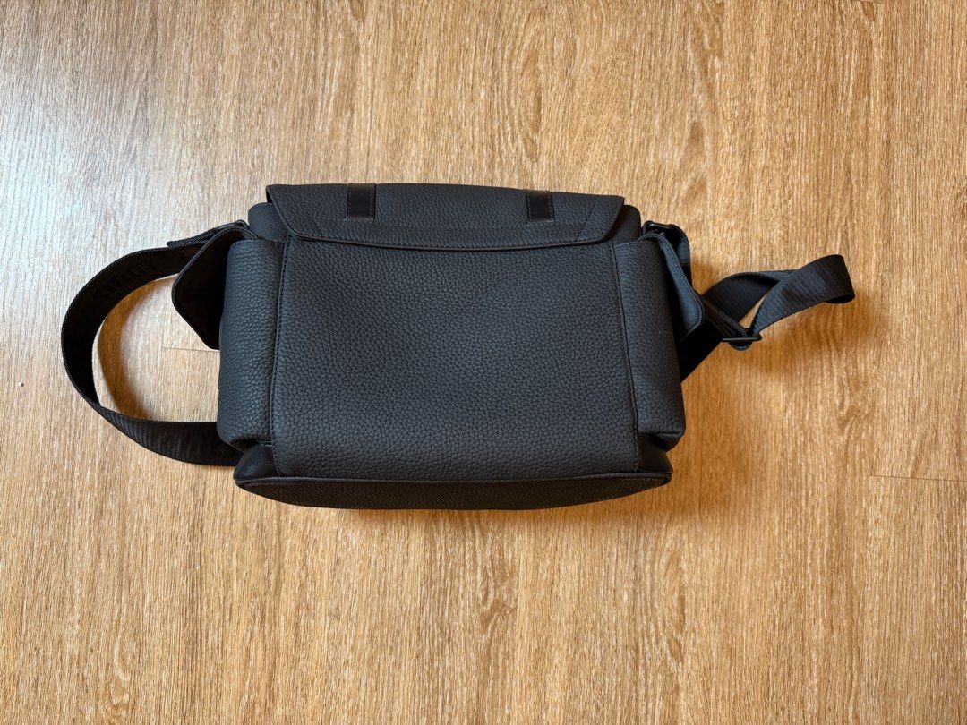 Louis Vuitton Messenger Bag - Black (Category: Bags & Wallets) located in Singapore. Submitted by letgoofthings (Listing ID 1378673487, Image 2). Description: Stylish Louis Vuitton messenger bag in excellent condition. Features a textured black leather exterior with a secure flap closure and adjustable shoulder strap. The interior includes multiple compartments for organization. Perfect for everyday use or travel..