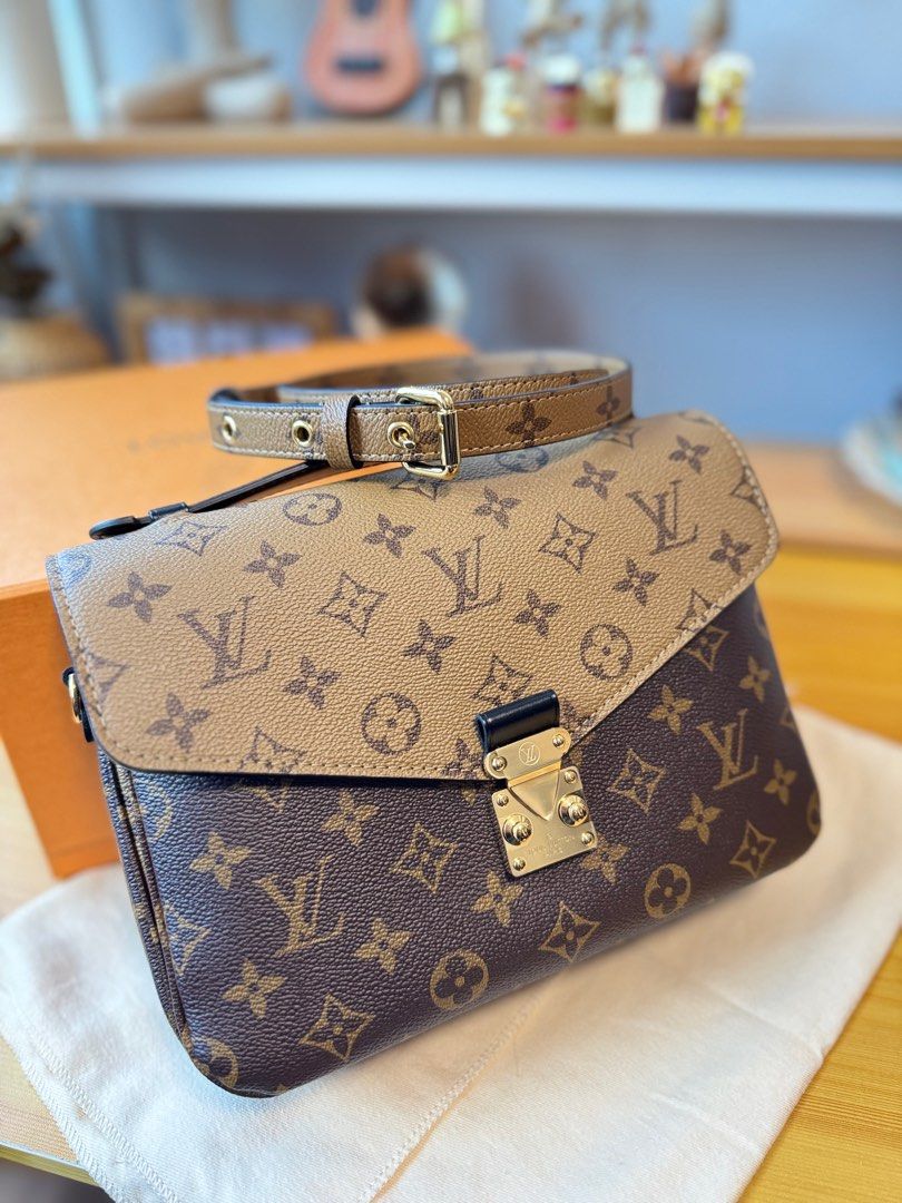 Louis Vuitton Monogram Shoulder Bag (Category: Bags & Wallets) located in Singapore. Submitted by daisydayg (Listing ID 1378637190, Image 2). Description: Authentic Louis Vuitton shoulder bag in excellent condition. Features the iconic monogram pattern and a stylish design. Includes a detachable strap for versatile carrying options. Perfect for everyday use or special occasions. Comes with original box. .