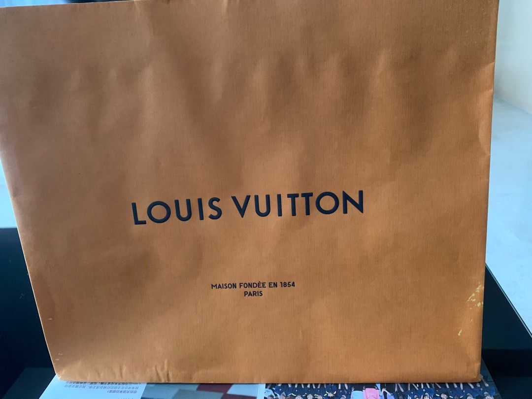 Louis Vuitton Shopping Bag (Category: Bags & Wallets) located in Singapore. Submitted by beautifulsun (Listing ID 1378649418, Image 1). Description: Authentic Louis Vuitton shopping paper bag. Perfect for gifting or collecting. Features the iconic Louis Vuitton logo and 'Maison Fondée en 1854 Paris' text. In excellent condition, with minimal signs of wear..