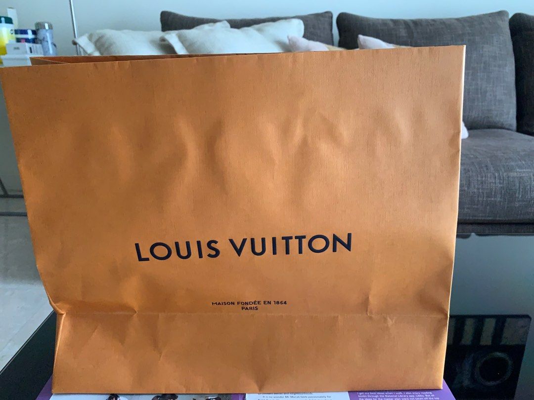Louis Vuitton Shopping Bag (Category: Bags & Wallets) located in Singapore. Submitted by beautifulsun (Listing ID 1378649418, Image 2). Description: Authentic Louis Vuitton shopping paper bag. Perfect for gifting or collecting. Features the iconic Louis Vuitton logo and 'Maison Fondée en 1854 Paris' text. In excellent condition, with minimal signs of wear..