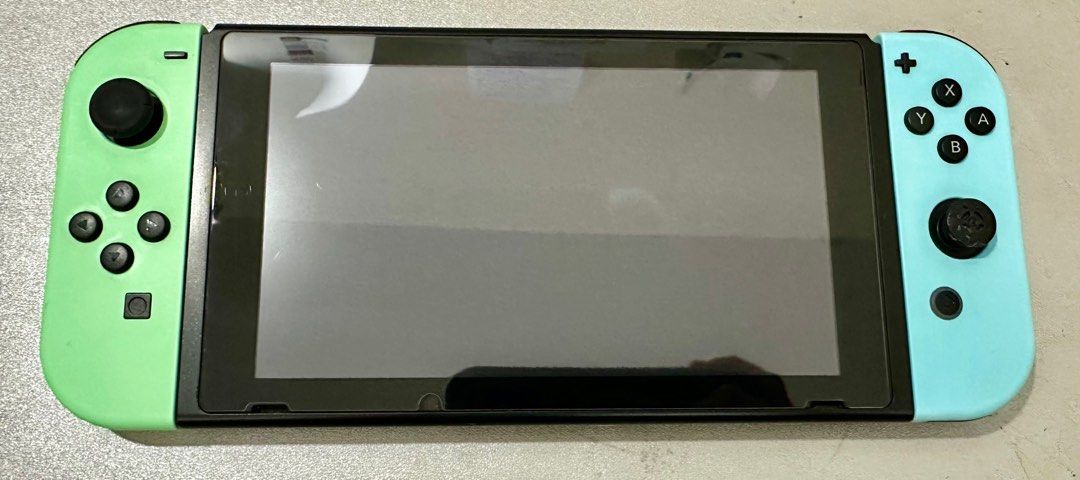MAKE OFFER Nintendo Switch v2 Animal Crossing Edition Jailbroken with games (Category: Nintendo) located in San Juan City. Submitted by angieanghelita (Listing ID 1378711371, Image 1). Description: 🚨 Slightly Used & In Excellent Condition! ✅ V2 Animal Crossing Limited Edition Console ✅ Jailbroken – Ready for custom firmware ✅ 256GB microSD card included ✅ Pre-installed with games ✅ Complete with Original Box & Joy-Cons ✅ Charger included (not sh