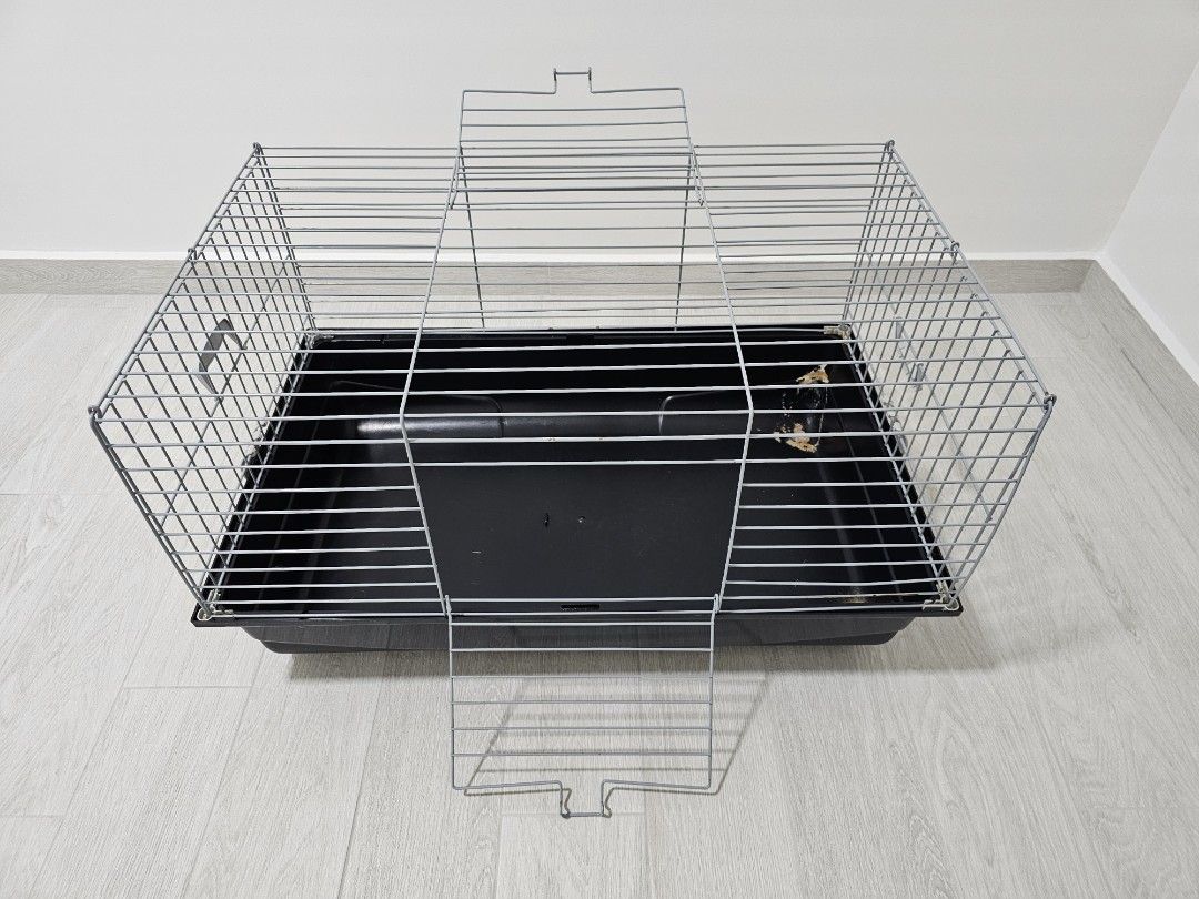 Pet Cage - Suitable for Rabbits, Guinea Pigs, and other Small Animals (Category: Homes & Other Pet Accessories) located in Singapore. Submitted by antimatter (Listing ID 1378699643, Image 1). Description: - Durable pet cage - Dimensions: 76cm (L) x 48cm (W) x 44cm (H) - Suitable for rabbits and guinea pigs - Removable tray for easy cleaning - Good condition - Wire top for ventilation and security Self-collect at my block in Canberra.