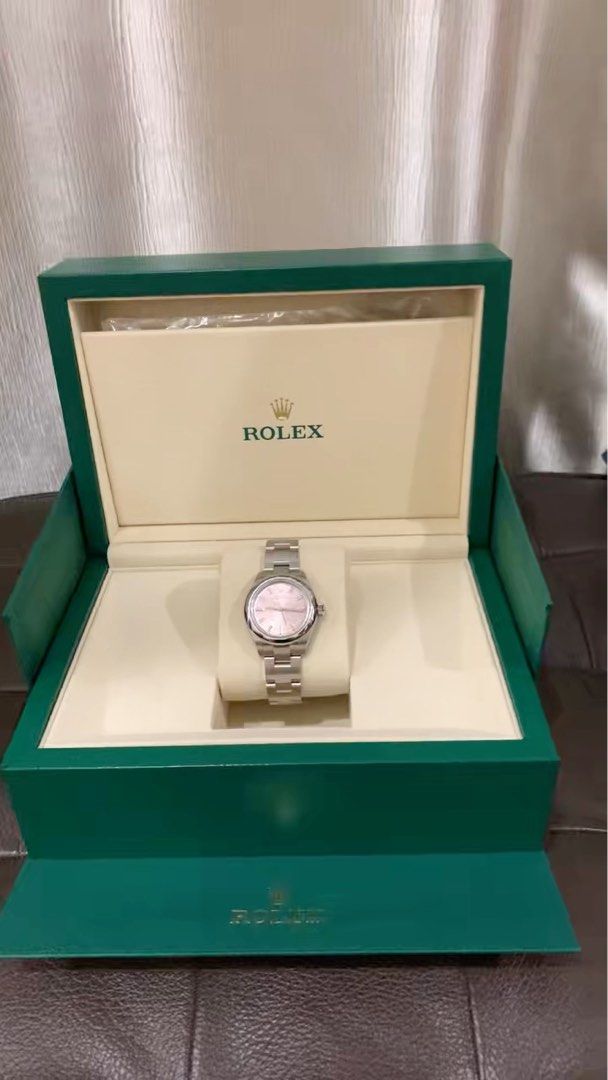 Rolex Oyster Perpetual 28 Stainless Steel Watch 276200 pink (Category: Watches) located in Singapore. Submitted by cavanong (Listing ID 1378669891, Image 1). Description: Check out this beautiful Rolex Oyster Perpetual 28 watch! It's brand new and comes in its original box. This watch is made of stainless steel and has a lovely pink dial. It's a full set, so you'll get everything that came with it. This is a great opportunity to own a classic Rol