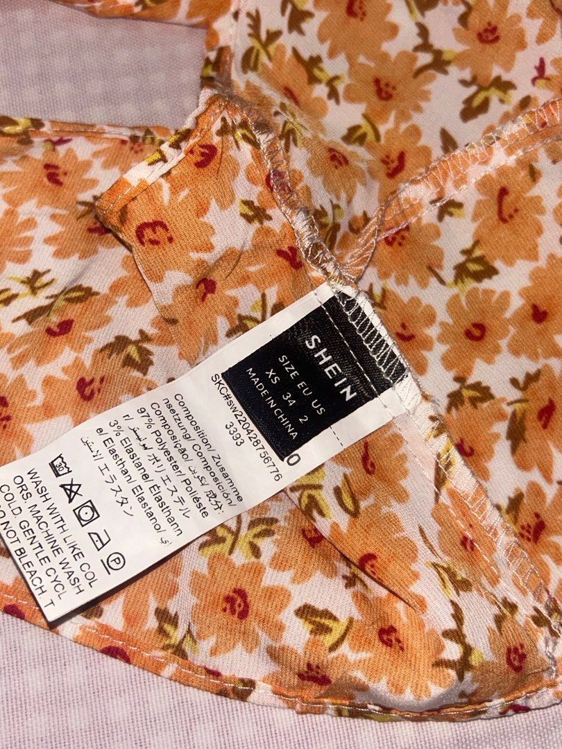 Shein Orange Floral Sleeveless Top (Category: Sleeveless) located in Quezon City. Submitted by heily0809 (Listing ID 1378690787, Image 3). Description: - Never worn - Still in a good condition - Xs on tag .