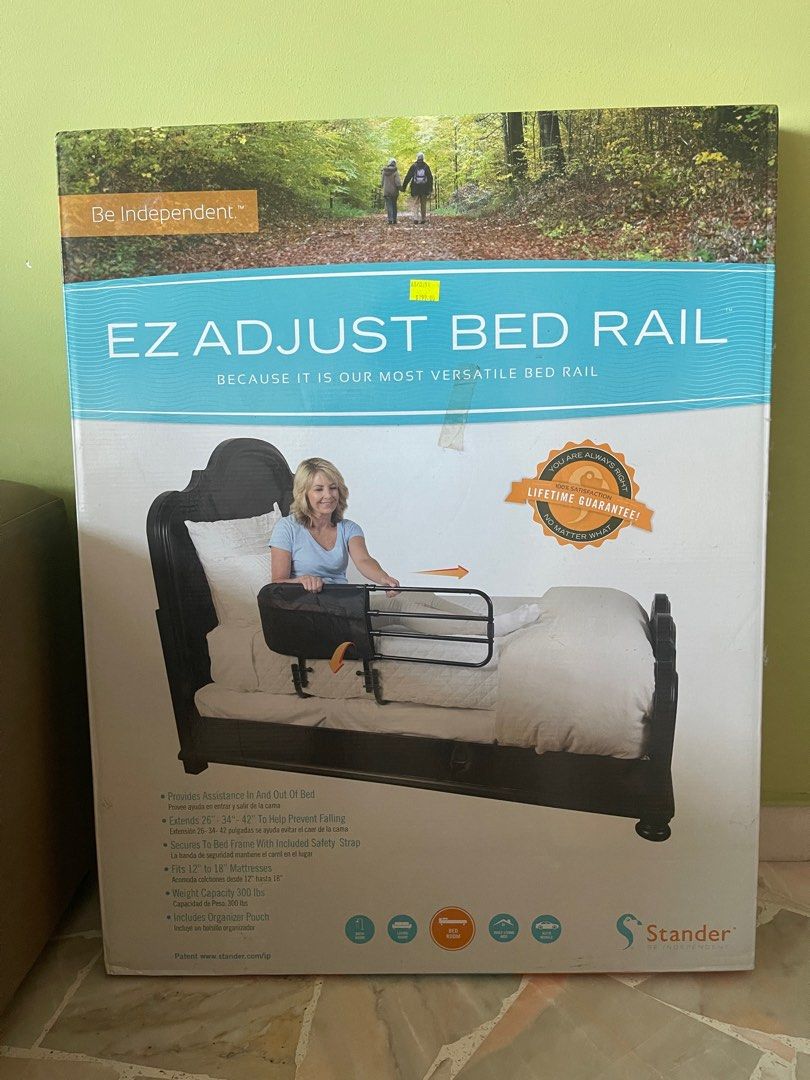Stander EZ Adjust Bed Rail (Category: Other Assistive Aids) located in Singapore. Submitted by salesboat (Listing ID 1378684087, Image 1). Description: This EZ Adjust Bed Rail by Stander provides assistance in and out of bed. It extends from 26" to 42" to help prevent falling and fits mattresses 12" to 18". Includes an organizer pouch and secures to the bed frame with an included safety strap. Weight capacity is 300 lbs..