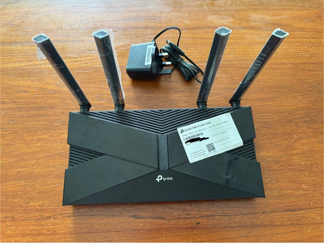TP-Link Archer AX20 AX1800 Dual-Band Wi-Fi 6 Router (Category: Networking) located in Singapore. Submitted by jrjclark (Listing ID 1378604399, Image 3). Description: Selling a TP-Link Archer AX1800 router. It has multiple LAN ports and a USB port. Includes the power adapter. The router is in good condition and ready for use. Perfect for upgrading your home network to Wi-Fi 6..