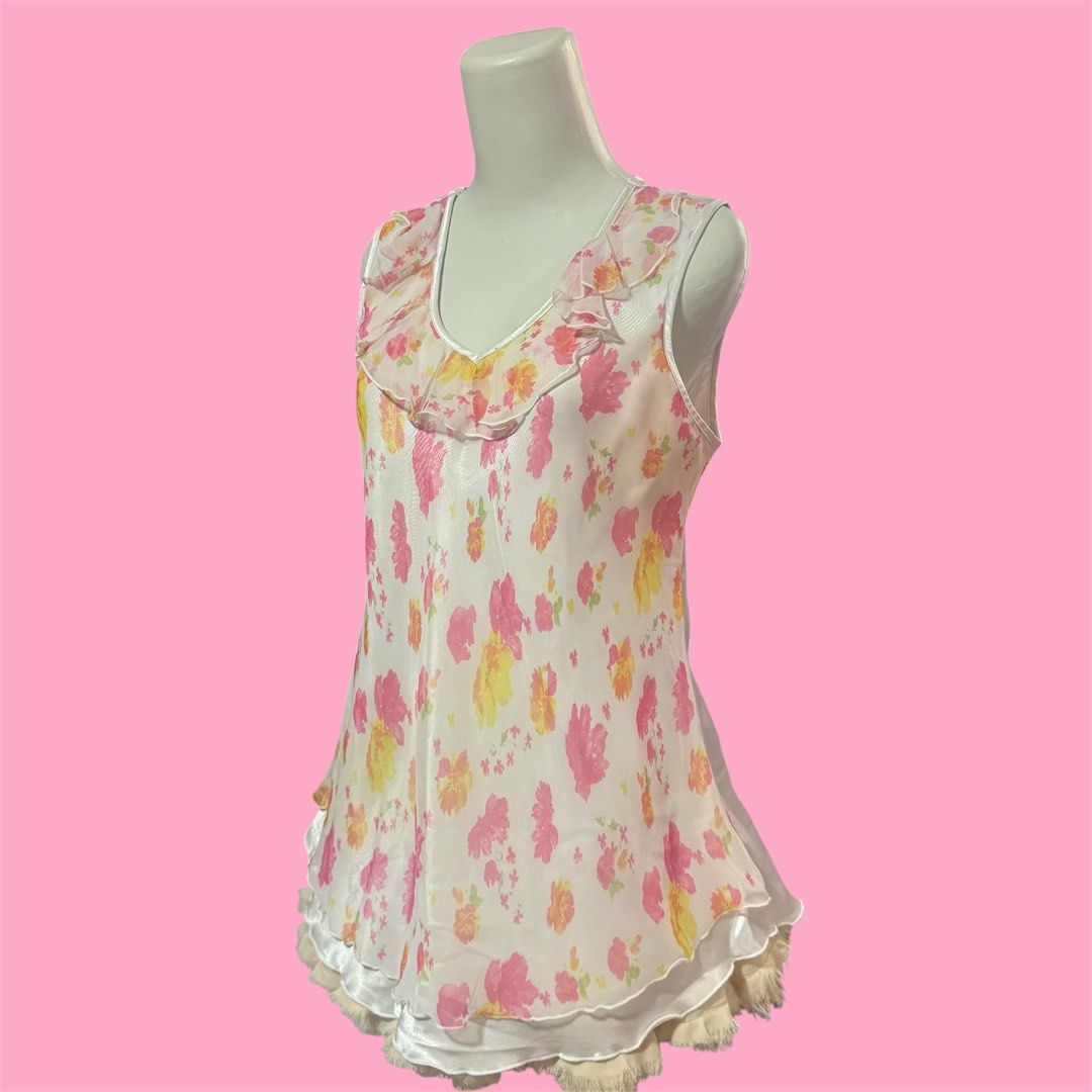 y2k cottagecore pink floral ruffle chiffon silk with lettuce trim top (Category: Sleeveless) located in Singapore. Submitted by poshich4n (Listing ID 1378569989, Image 2). Description: yes avail no nego or trades postage additional $2.50 | meetup Yishun good condition fits M-L ptp 19 inch across 25.5 inch length down.