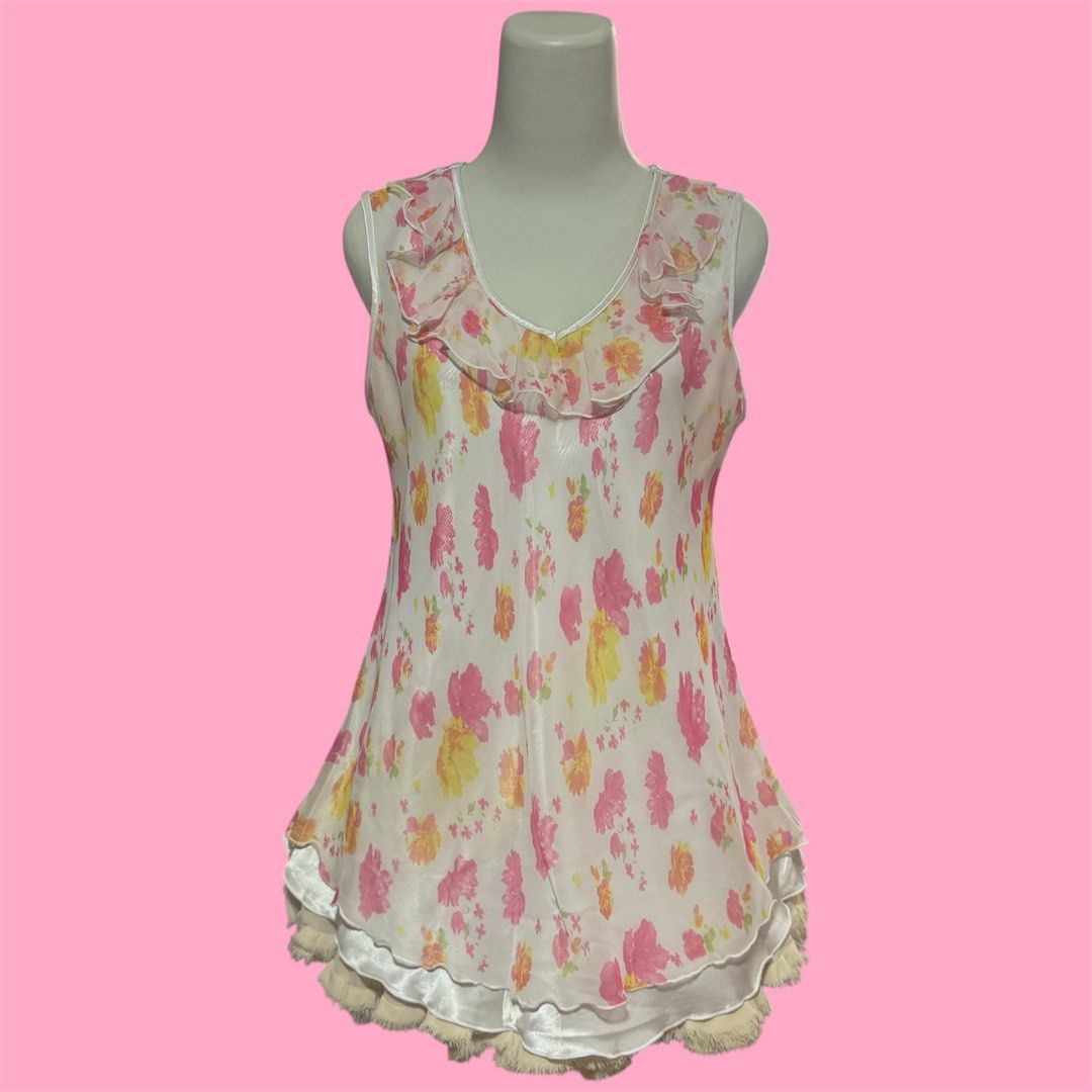 y2k cottagecore pink floral ruffle chiffon silk with lettuce trim top (Category: Sleeveless) located in Singapore. Submitted by poshich4n (Listing ID 1378569989, Image 1). Description: yes avail no nego or trades postage additional $2.50 | meetup Yishun good condition fits M-L ptp 19 inch across 25.5 inch length down.