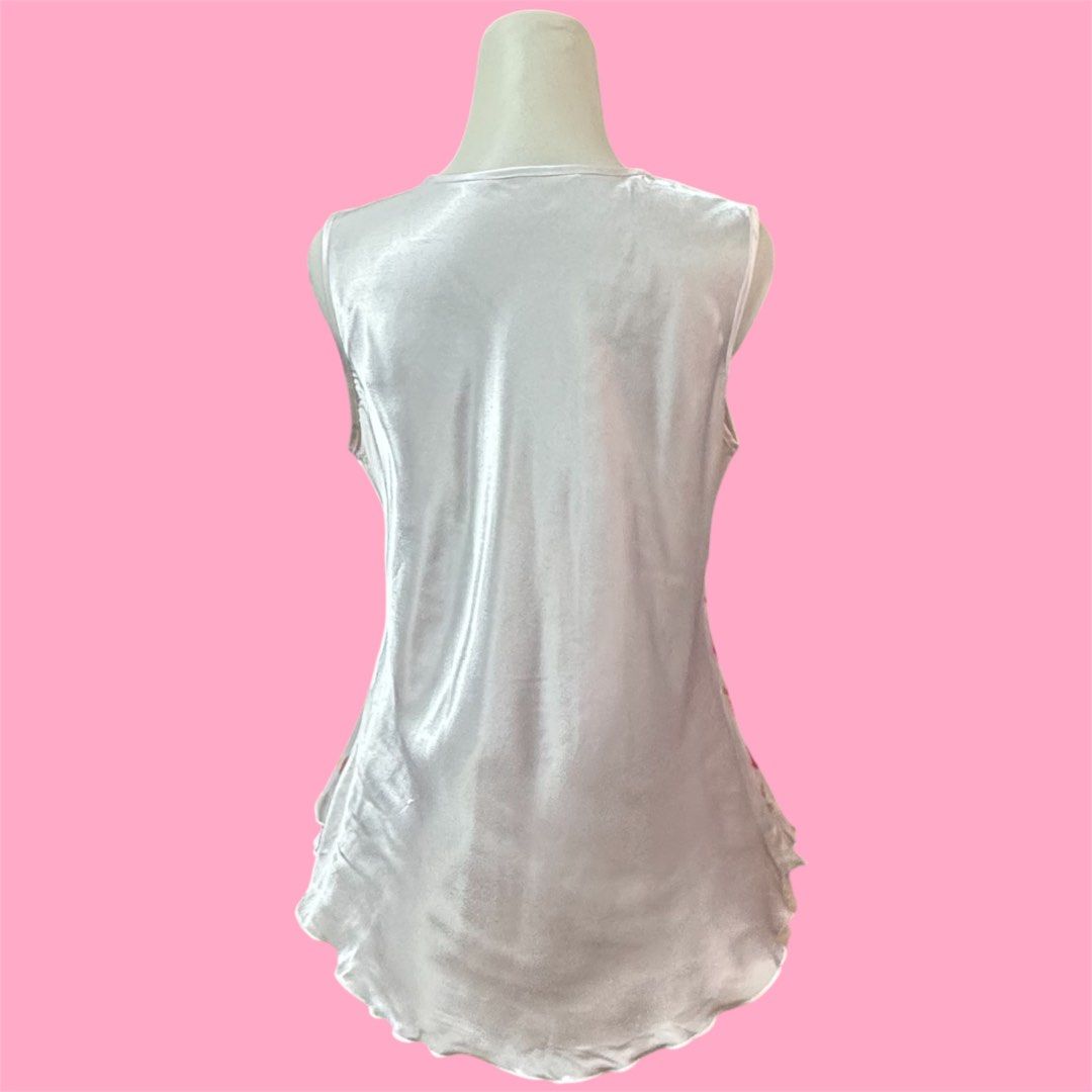 y2k cottagecore pink floral ruffle chiffon silk with lettuce trim top (Category: Sleeveless) located in Singapore. Submitted by poshich4n (Listing ID 1378569989, Image 3). Description: yes avail no nego or trades postage additional $2.50 | meetup Yishun good condition fits M-L ptp 19 inch across 25.5 inch length down.