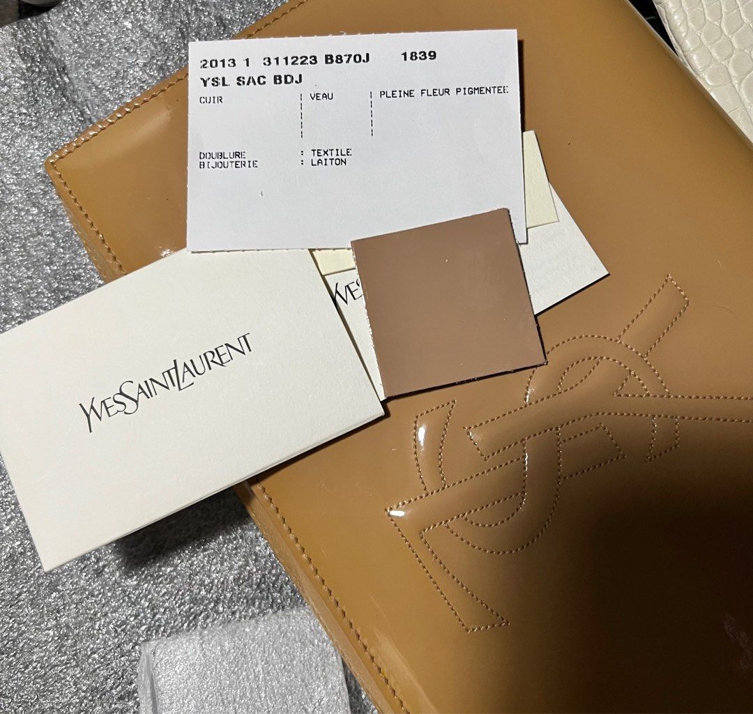 Ysl Clutch (Category: Luxury Bags & Wallets) located in Valenzuela. Submitted by happyhabit (Listing ID 1371465894, Image 1). Description: Authentic Yves Saint Laurent Beige Patent Leather Belle De Jour Clutch ❗️Please review photos carefully to ensure clarity on condition. Not brand new, but in good condition as shown. Condition: Good, ink stain at the back, discoloration ❗️Patent leather, particularly lighter shades, can change color due to sta