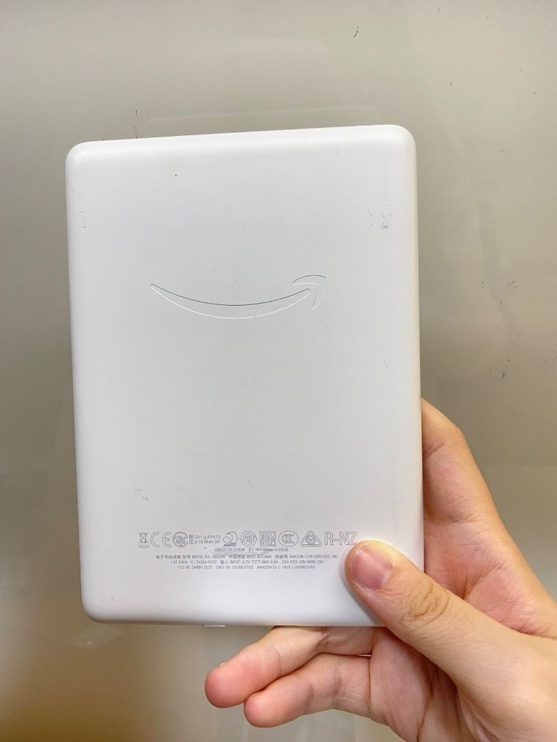 Amazon Kindle E-reader - White (Category: E-Readers) located in Singapore. Submitted by gweenteamo37386 (Listing ID 1378895454, Image 2). Description: Up for sale is a Kindle Paperwhite e-reader. The device is white. The model number is J9G29R. Additional details are shown in the images. .
