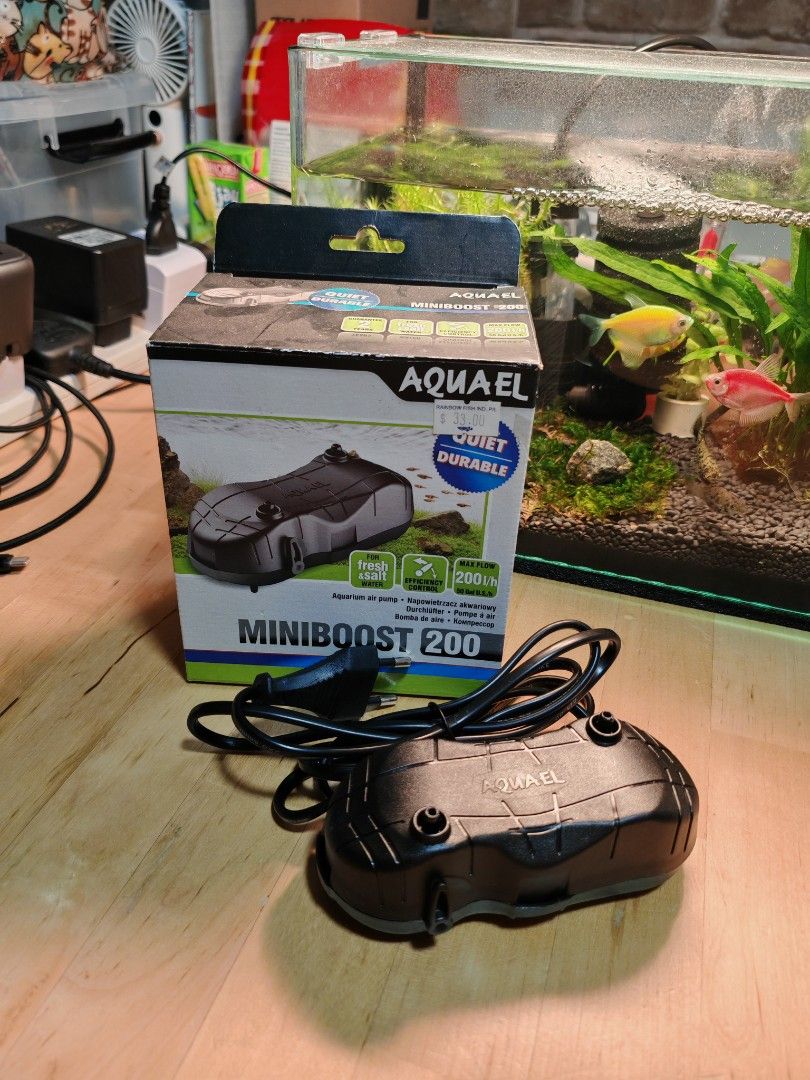 Fish tank Aquarium Air Pump (Category: Homes & Other Pet Accessories) located in Singapore. Submitted by danwhat (Listing ID 1378770490, Image 1). Description: only used for 1 week. too powerful for my little guppy tank. -made in Poland - AQUAEL MiniBoost 200 air pump - Quiet and durable operation - Comes with original packaging - Easy setup and use - Perfect for small to medium aquariums - Keeps your aquarium water oxygenated pick up at bukit pa