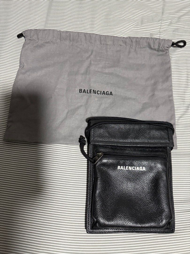 Balenciaga Leather Crossbody Bag with Dust Bag (Category: Bags & Wallets) located in Singapore. Submitted by iamheretosell123 (Listing ID 1378733635, Image 1). Description: This Balenciaga crossbody bag is in excellent condition. It features a black leather exterior with a zippered pocket and a front pocket. Includes the original dust bag. Perfect for carrying essentials in style..