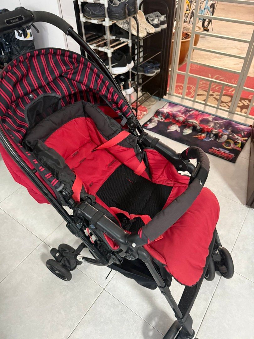 Combi Stroller - Red and Black + 1 free gift (Category: Strollers) located in Singapore. Submitted by songchee (Listing ID 1378726933, Image 1). Description: Used Combi stroller in good condition. Red and black color. Comfortable and sturdy, ready for use. Free 1 item from my listing album .