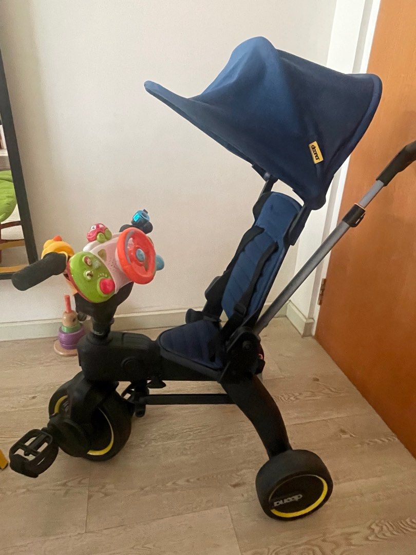 Doona S3 Liki trike (Blue) (Category: Strollers) located in Singapore. Submitted by naughtyegg228 (Listing ID 1378779245, Image 2). Description: Included storage bag, steering wheel driving toy (with sounds).