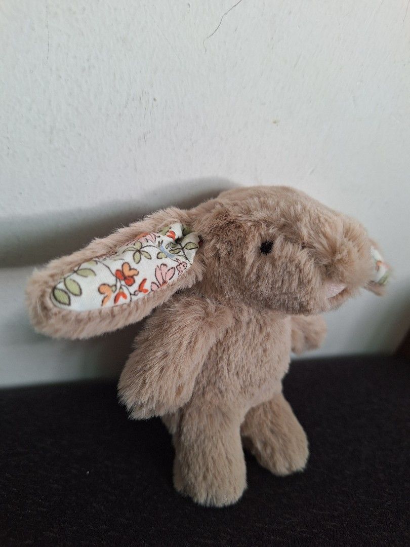 Jellycat Beige Bunny Keychain (Category: Toys & Games) located in Singapore. Submitted by jane101929 (Listing ID 1378742687, Image 3). Description: - Adorable Jellycat bunny keychain - Soft, plush exterior - Features floral patterned ears - Includes a silver keyring - Comes with Jellycat tag - Perfect for keys or bags.