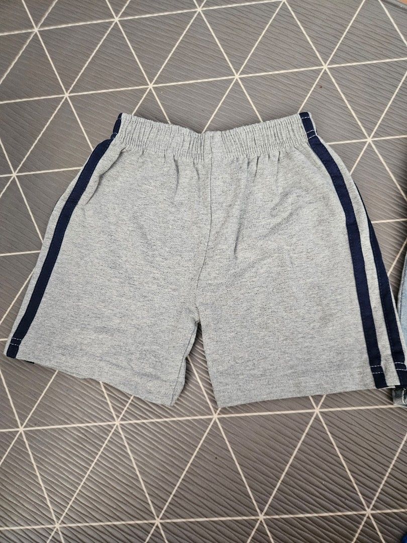 Kids' Cotton Shorts - Size 4T & 5T (Category: Babies & Kids Fashion) located in Singapore. Submitted by longlongsleeves (Listing ID 1378799551, Image 2). Description: - Two pairs of kids' cotton shorts - Grey shorts with navy stripes (Size 4T) - Navy shorts with white stripes (Size 5T) - Both pairs have elastic waistbands - washed but barely used as child prefers long pants.