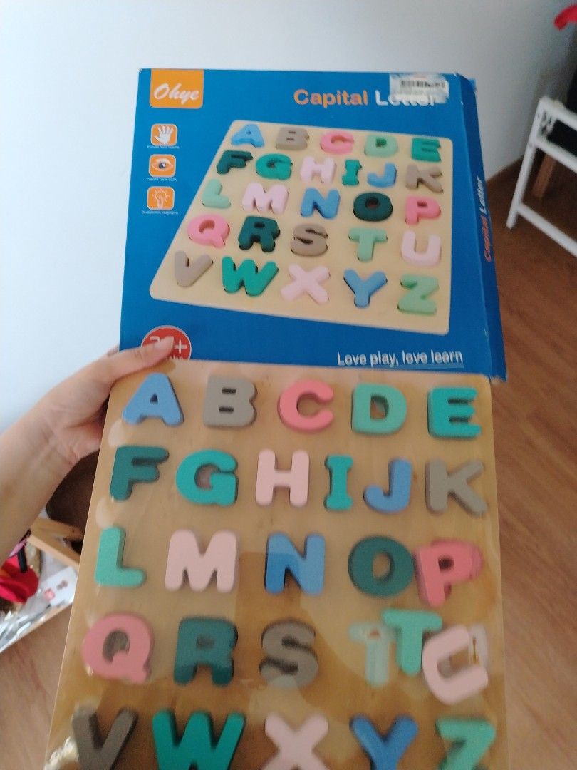 Letter wooden puzzle (Category: Infant Playtime) located in Singapore. Submitted by imrudelikethis (Listing ID 1378737378, Image 1). Description: Please clean before using Long term storage.