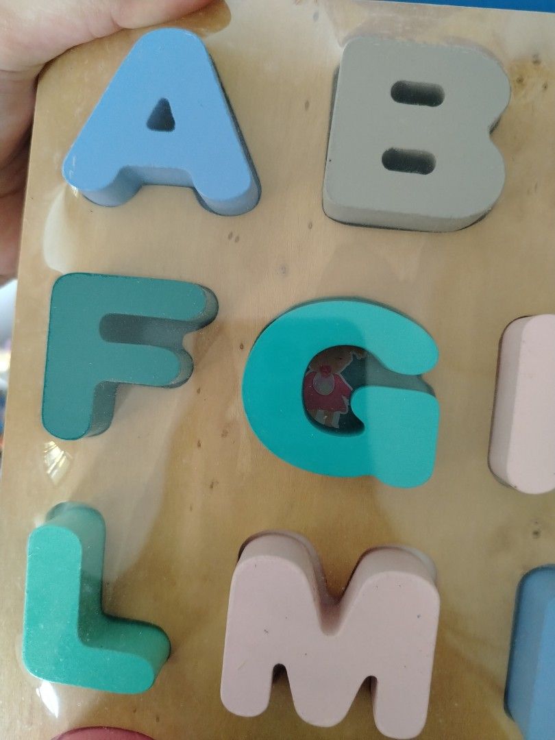 Letter wooden puzzle (Category: Infant Playtime) located in Singapore. Submitted by imrudelikethis (Listing ID 1378737378, Image 3). Description: Please clean before using Long term storage.