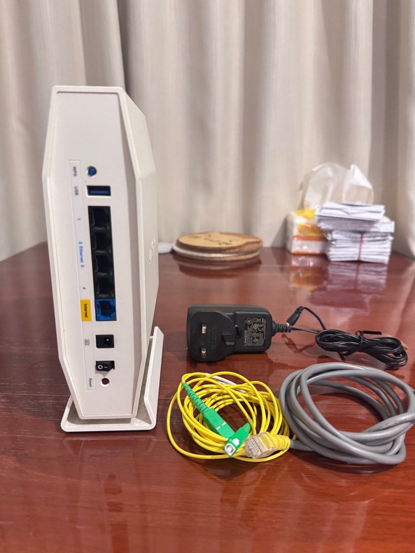 Linksys Router - Model WRT1900AC (Category: Networking) located in Singapore. Submitted by lynn_wu18 (Listing ID 1378874555, Image 3). Description: Selling a Linksys WRT1900AC router. Wifi 6 supported. Whole pack Includes the router itself, power adapter, ethernet cable, and fiber optic cable. Tested and working. Great for home or small office use. Please see photos for details..