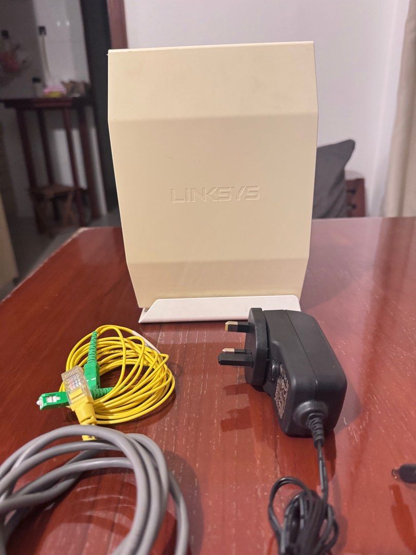Linksys Router - Model WRT1900AC (Category: Networking) located in Singapore. Submitted by lynn_wu18 (Listing ID 1378874555, Image 2). Description: Selling a Linksys WRT1900AC router. Wifi 6 supported. Whole pack Includes the router itself, power adapter, ethernet cable, and fiber optic cable. Tested and working. Great for home or small office use. Please see photos for details..