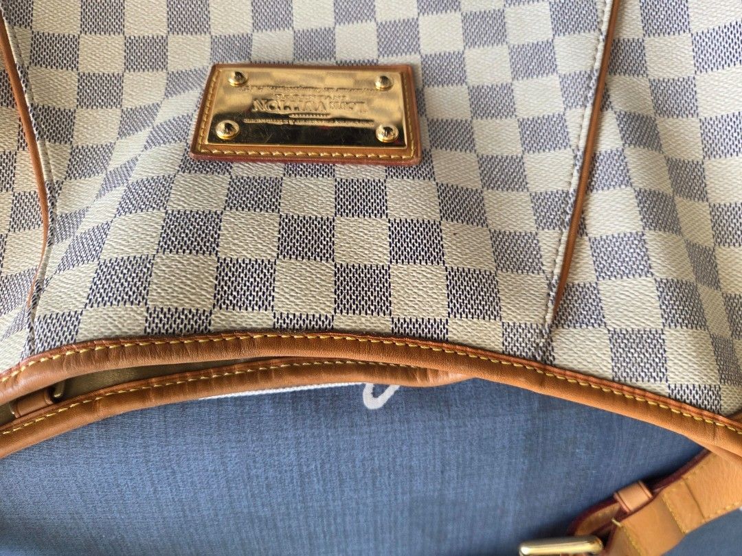 Louis Vuitton Damier Azur Canvas Artsy MM Hobo Bag (Category: Bags & Wallets) located in Singapore. Submitted by clearanxw (Listing ID 1378898631, Image 2). Description: - Authentic Louis Vuitton Artsy MM hobo bag - Damier Azur canvas - Spacious interior with fabric lining - Signs of wear on leather trim and strap - Some marks inside the bag - Hardware in good condition - Stylish and functional.
