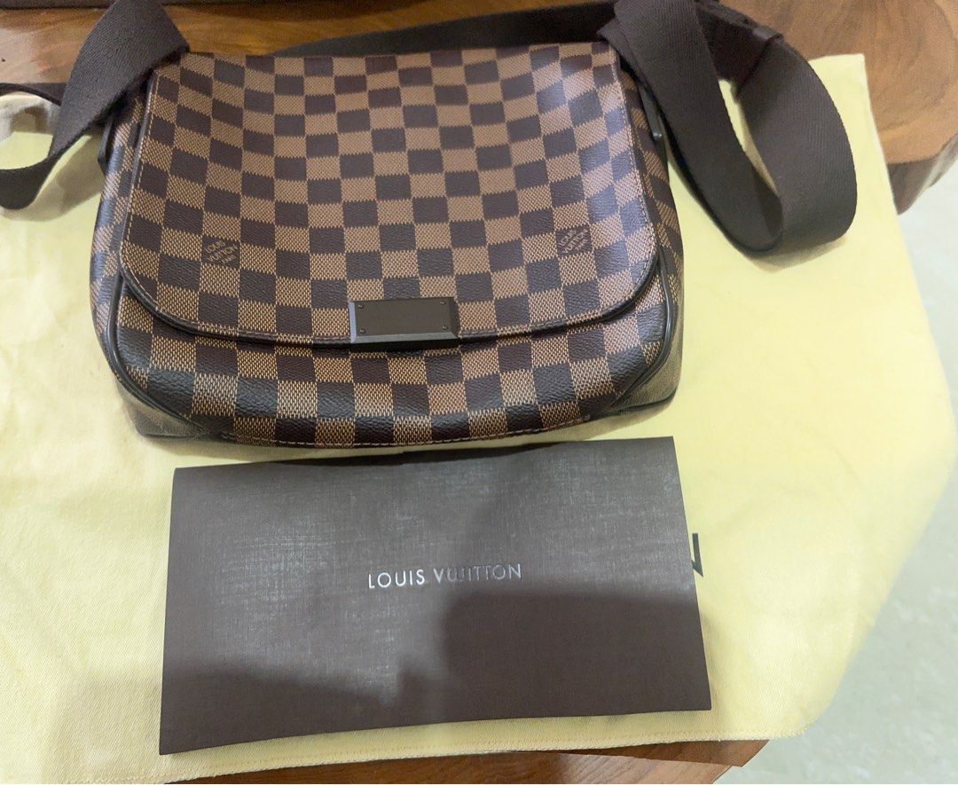 Louis Vuitton Messanger Crossbody Bag, brown in Coated Canvas. N41213 District Damier Eben (Category: Bags & Wallets) located in Singapore. Submitted by waniadil (Listing ID 1378828063, Image 2). Description: Bought in sg Louis Vuitton crossbody bag, comes with dust bag. Letting go as not being used. 100% Authentic, Have receipt to show its original LV bag. Condition 9/10 Fix price.