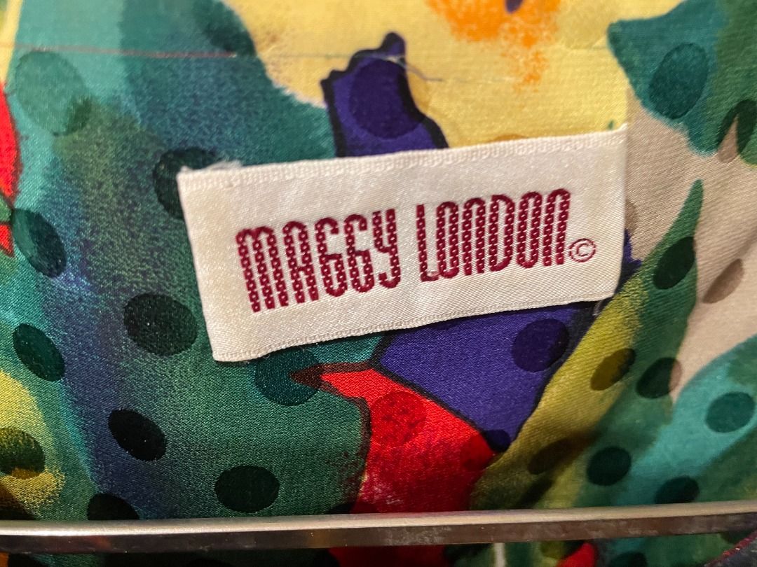 Maggy London Vintage Floral Print Blouse and Skirt Set - can fit size S (Category: Blouses) located in Singapore. Submitted by panadol73 (Listing ID 1378754943, Image 3). Description: Beautiful vintage skirt with a vibrant floral print. Features a colourful design with red, yellow, purple, and green flowers. The skirt is in good condition, perfect for adding a pop of colour to your wardrobe. A unique piece for any vintage lover..