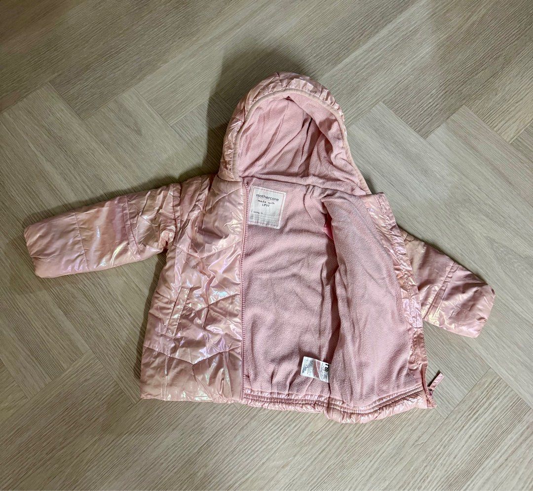 Mothercare Winter Puffer Jacket (Category: Babies & Kids Fashion) located in Singapore. Submitted by peppermintyy (Listing ID 1378872336, Image 1). Description: Lovely Next baby jacket in a shimmering pink colour. Features a cozy fleece lining and a hood for extra warmth. Size: 2-3 years (Size runs big) Condition: 9/10.