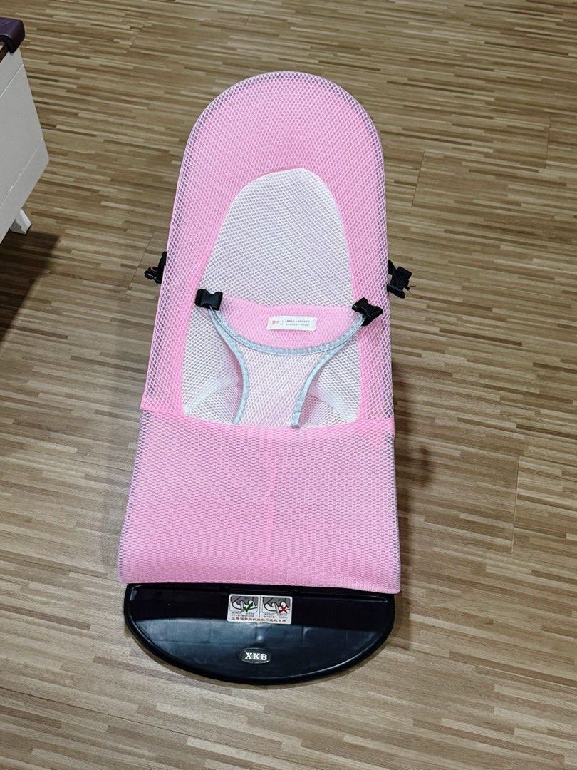 Pink Baby Bouncer with Toys (Category: Infant Playtime) located in Singapore. Submitted by r3gr3tful (Listing ID 1378827794, Image 2). Description: This baby bouncer is in great condition! It features a comfortable mesh seat and comes with hanging toys to entertain your little one. The bouncer is easy to clean and folds for convenient storage. Perfect for newborns and infants..