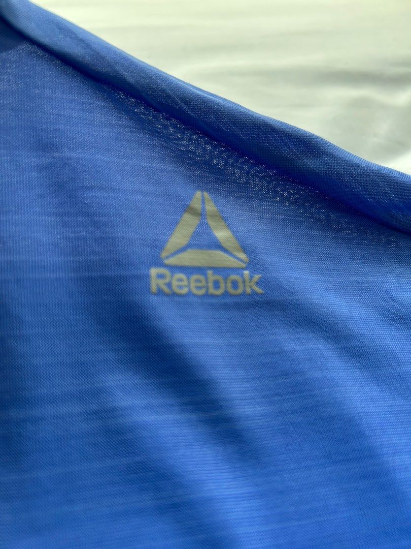 Reebok blue t Shirt (Category: Activewear) located in Singapore. Submitted by hennyturangan (Listing ID 1378874186, Image 3). Description: Thin cool material Ladies cut Price included tracked mail to sg address.