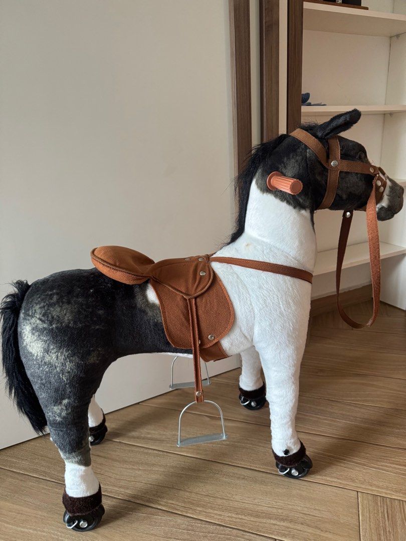 Rocking Horse with Saddle (Category: Infant Playtime) located in Singapore. Submitted by herviciousvanity (Listing ID 1378824717, Image 1). Description: ✨Adorable rocking horse with a saddle. Features a black and white color scheme. Includes a saddle, reins, and stirrups. There is a small stain on the side of the horse. Great for young children. .