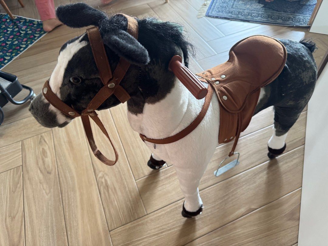 Rocking Horse with Saddle (Category: Infant Playtime) located in Singapore. Submitted by herviciousvanity (Listing ID 1378824717, Image 2). Description: ✨Adorable rocking horse with a saddle. Features a black and white color scheme. Includes a saddle, reins, and stirrups. There is a small stain on the side of the horse. Great for young children. .