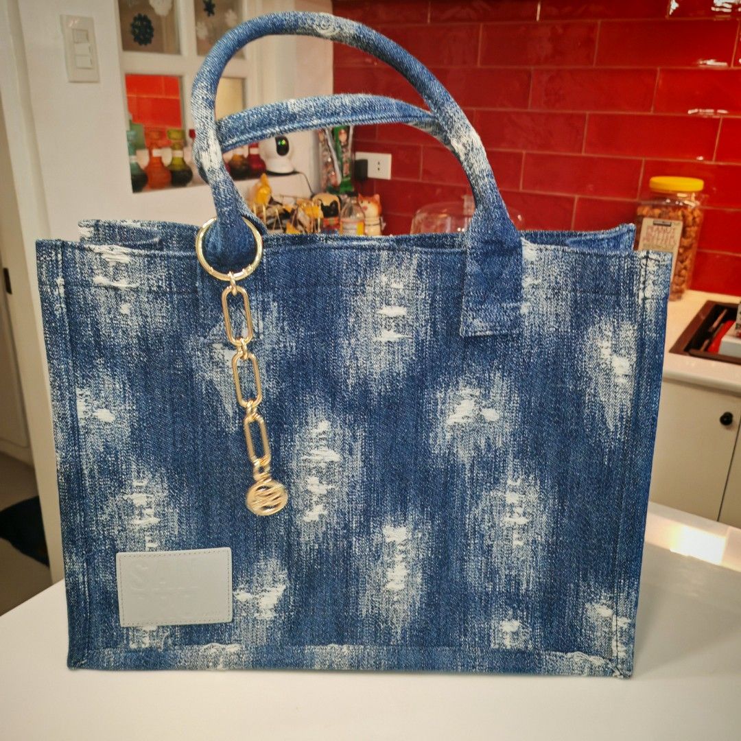 Sandro Distressed Denim Tote Bag (Category: Luxury Bags & Wallets) located in Caloocan City. Submitted by det123123 (Listing ID 1378855487, Image 2). Description: Sandro Distressed Denim Tote Bag Lightly Used Bought in US With dust bag Made in Turkey.