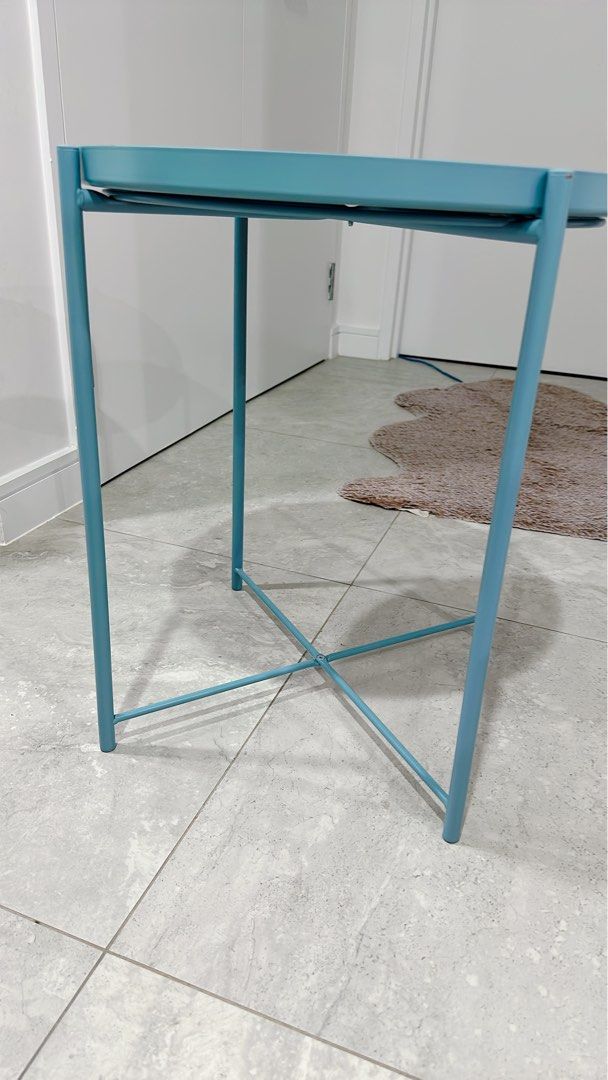 Set of Ikea GLADOM Tray table, blue, 45x53 cm (Category: Home Decor) located in Miranda. Submitted by abbie.corner (Listing ID 1378779792, Image 3). Description: Pick up from Kirrawee Beautiful colour, in very condition, the trays have some colour marks from using but looks more like ombré GLADOM Tray table, blue, 45x53 cm This colour is not on sale anymore Height: 53 cm Diameter: 45 cm Max. load: 10 kg You can use the removable tray for serving.