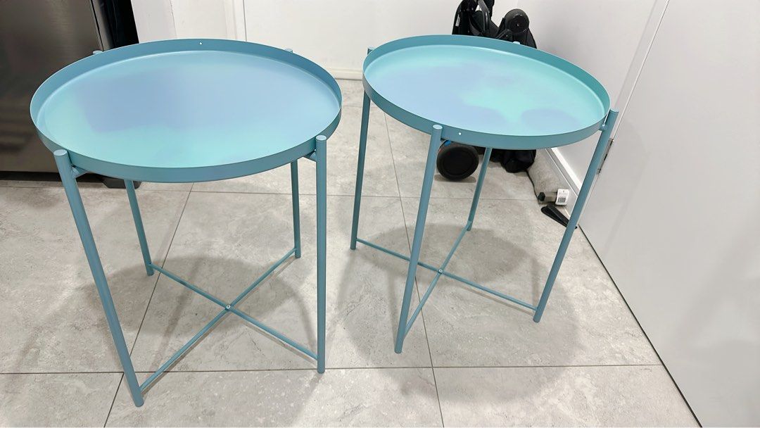 Set of Ikea GLADOM Tray table, blue, 45x53 cm (Category: Home Decor) located in Miranda. Submitted by abbie.corner (Listing ID 1378779792, Image 2). Description: Pick up from Kirrawee Beautiful colour, in very condition, the trays have some colour marks from using but looks more like ombré GLADOM Tray table, blue, 45x53 cm This colour is not on sale anymore Height: 53 cm Diameter: 45 cm Max. load: 10 kg You can use the removable tray for serving.