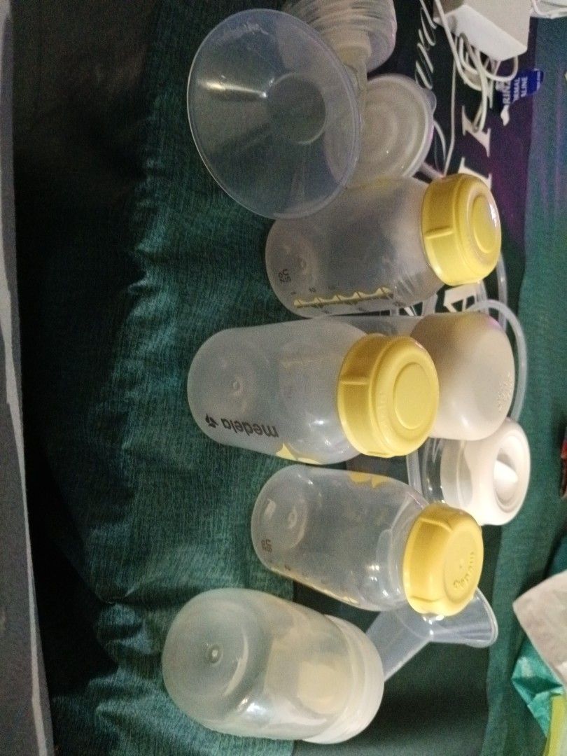 Spectra breast parts and tubing's. (Category: Breastfeeding & Bottle Feeding) located in Singapore. Submitted by mumtaz16hu39563 (Listing ID 1378850697, Image 3). Description: Medela breast milk bottles, spectra pump parts, and tubing. Clean and ready to use. Great for extra bottles or replacements. Bottles have measurement markings..
