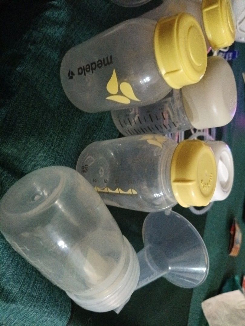 Spectra breast parts and tubing's. (Category: Breastfeeding & Bottle Feeding) located in Singapore. Submitted by mumtaz16hu39563 (Listing ID 1378850697, Image 2). Description: Medela breast milk bottles, spectra pump parts, and tubing. Clean and ready to use. Great for extra bottles or replacements. Bottles have measurement markings..