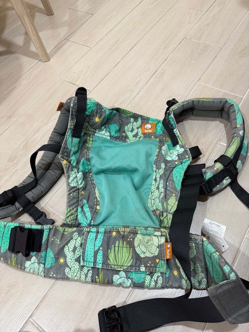 Tula Baby Carrier - Cactus Print (Category: Carriers & Slings) located in Singapore. Submitted by moussie87 (Listing ID 1378847105, Image 1). Description: Gently used Tula baby carrier in a fun cactus print. Features adjustable straps and a breathable mesh panel for comfort. Perfect for carrying your little one. In great condition, ready for a new home!.