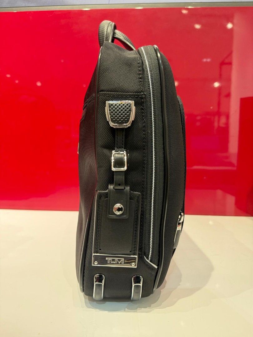Tumi Briefcase - Black Arrive (Category: Laptop Bags & Sleeves) located in Singapore. Submitted by Dinobong (Listing ID 1378920445, Image 2). Description: - Tumi briefcase in excellent condition - Sleek black design - Multiple compartments for organization - Includes top handle and detachable shoulder strap - Perfect for professionals -Got it from lucky draw winning -It Legit item from Tumi.