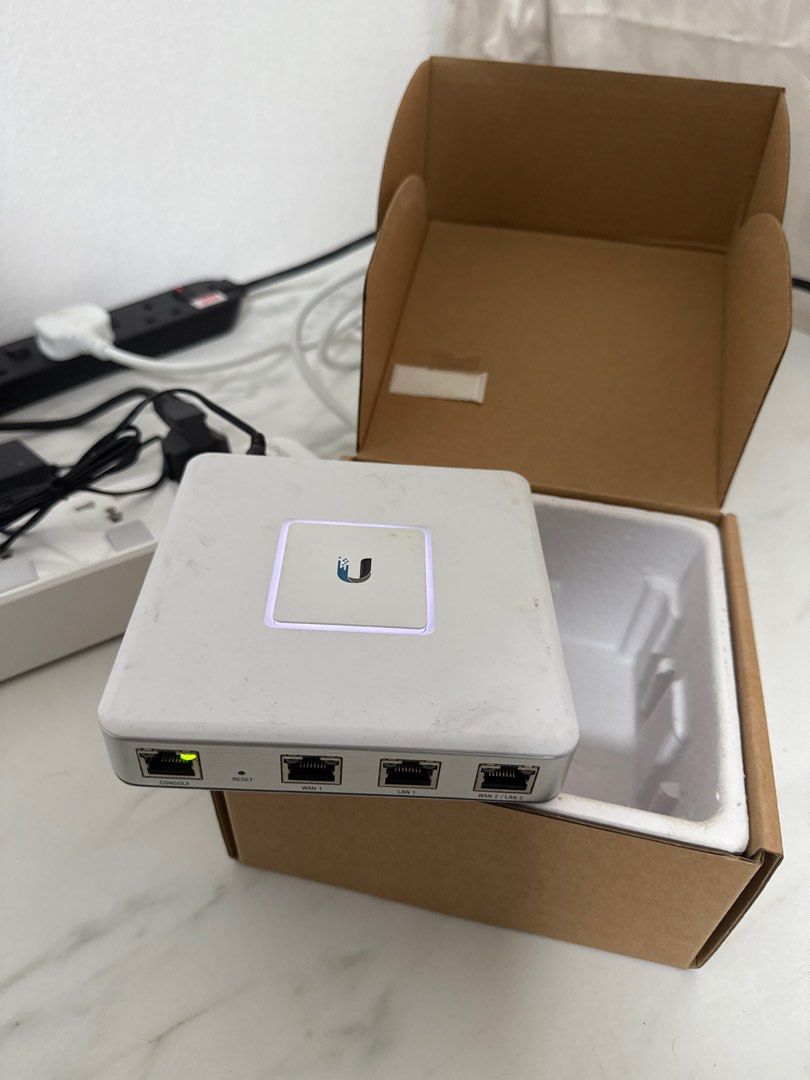 Ubiquiti UniFi Security Gateway (USG) (Category: Networking) located in Singapore. Submitted by cavijayan (Listing ID 1378643848, Image 2). Description: Ubiquiti UniFi Security Gateway (USG). Enterprise gateway router with Gigabit Ethernet. Includes Quick Start Guide. Perfect for home or small business network security. Comes with device and power cable. Box looks a little dirty from storage..