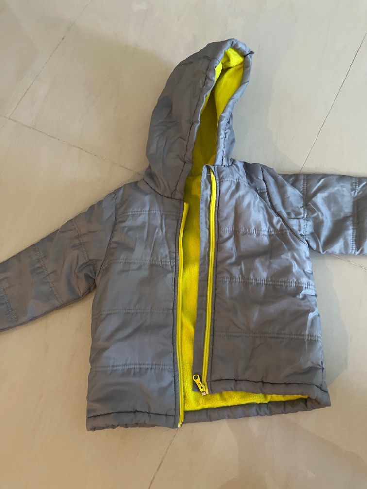 Winter jacket (Category: Babies & Kids Fashion) located in Singapore. Submitted by lzmaboo (Listing ID 1378837836, Image 3). Description: 2 piece winter wear Quechua orange jacket size 98cm/3 Waterproof grey jacket with hood size 98.