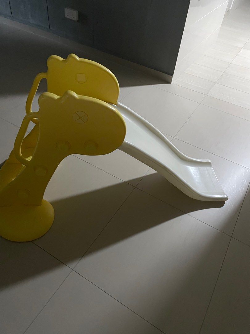 Yellow Giraffe Kids Slide (Category: Infant Playtime) located in Singapore. Submitted by mini_sha_k (Listing ID 1378823822, Image 2). Description: Good condition kids' slide with giraffe design. Suitable for indoor/outdoor use. Easy to assemble and store. Perfect for toddlers..