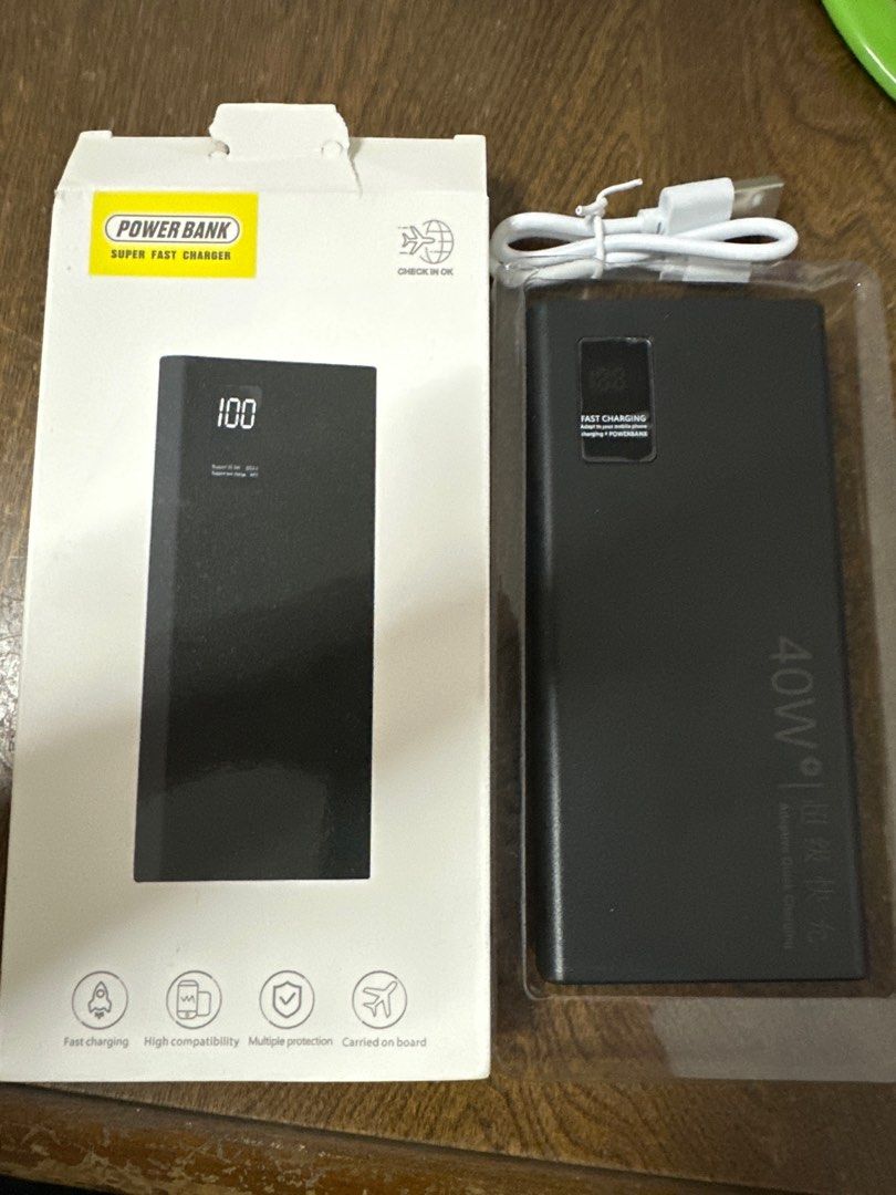 40W Super Fast Charging Power Bank (Category: Power Banks & Chargers) located in Singapore. Submitted by kwan99k (Listing ID 1379095609, Image 1). Description: This power bank offers super fast charging capabilities. It features a digital display showing the remaining charge. It is designed for high compatibility and multiple protection. Comes with a charging cable..