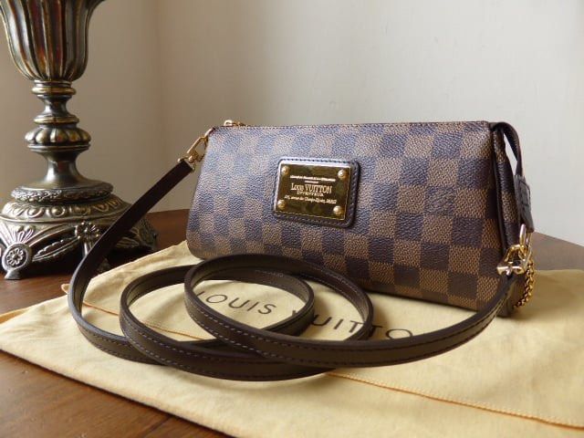[ DEAL] Louis Vuitton Eva Clutch Damier Ebene Crossbody Pochette Bag Authentic Vintage (Category: Bags & Wallets) located in Singapore. Submitted by giantgiantic (Listing ID 1378934568, Image 1). Description: Lightly used Hardly reached out to this clutch. Selling to clear space Code: AA2150 Comes with crossbody strap and bag only No box or card Approx Measurements: 25x13x 4 (cm) Condition: 8.5/10 [ DEAL] Louis Vuitton Eva Clutch Damier Ebene Cro