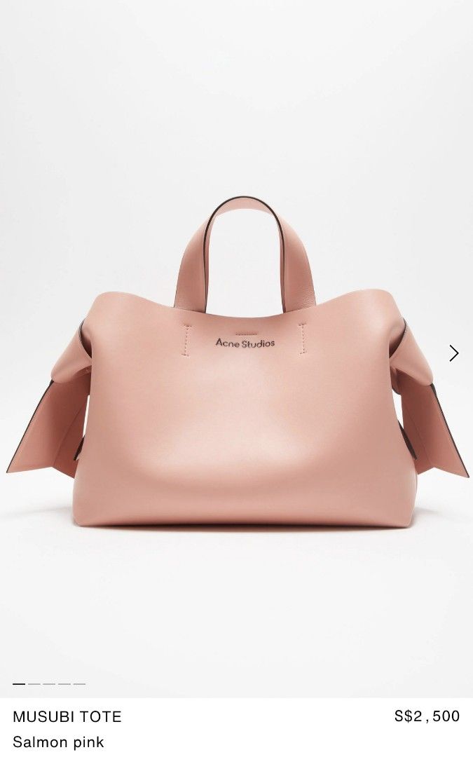 Acne Studios Musubi Tote - Salmon Pink (Category: Bags & Wallets) located in Singapore. Submitted by mrsloth93 (Listing ID 1379078900, Image 1). Description: Received as a gift but not suitable for me. keep in the dust bag and never use before. don't have receipt because it was a gift. negotiable if you really interested - Authentic Acne Studios Musubi Tote - Salmon pink color - Unique knot detail - Top handles - Spacious interior - Ideal for eve