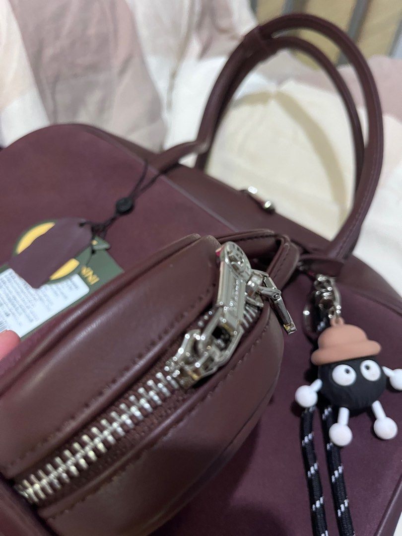 ANNI Handbag with Coin Purse - Brand New (Category: Bags & Wallets) located in Singapore. Submitted by wanshyuan014057 (Listing ID 1379073917, Image 2). Description: Brand new ANNI handbag with a matching coin purse. Features a spacious interior with a small zippered pocket. Comes with original tags and a cute charm. Perfect for everyday use or as a gift..