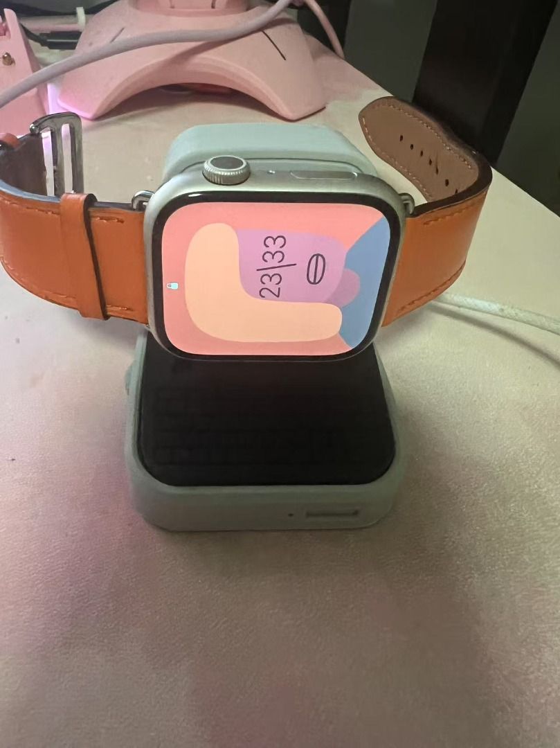 Apple Watch Series 9 with Orange Leather Band (Category: Wearables & Smart Watches) located in Singapore. Submitted by kevinsun1959 (Listing ID 1379100985, Image 2). Description: Apple Watch Series 9 is in excellent condition. Comes with an orange leather band and a charging dock. The screen is perfect, with no scratches or dead pixels..