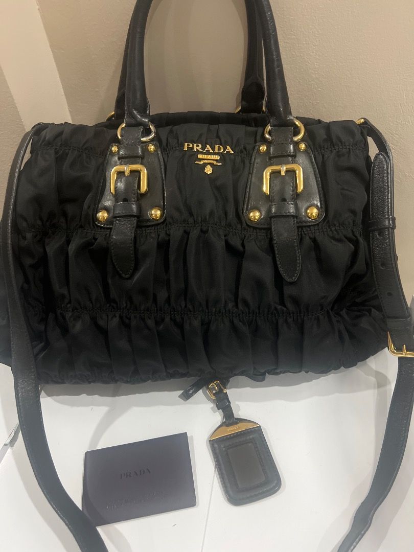 Authentic Prada Tessuto Gaufre (Category: Luxury Bags & Wallets) located in Caloocan City. Submitted by icecoco1977 (Listing ID 1379054111, Image 1). Description: Black authentic tessuto gaufre prada bag. Complete with authenticity card, nametag. With sling include.