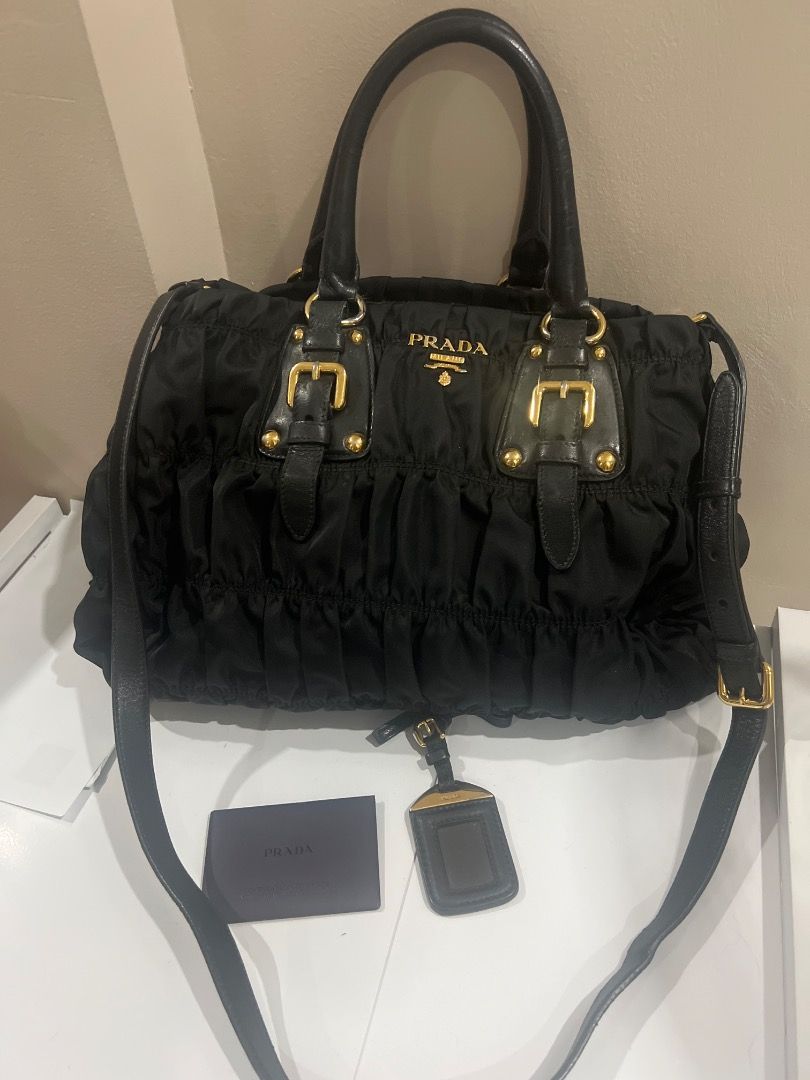 Authentic Prada Tessuto Gaufre (Category: Luxury Bags & Wallets) located in Caloocan City. Submitted by icecoco1977 (Listing ID 1379054111, Image 2). Description: Black authentic tessuto gaufre prada bag. Complete with authenticity card, nametag. With sling include.